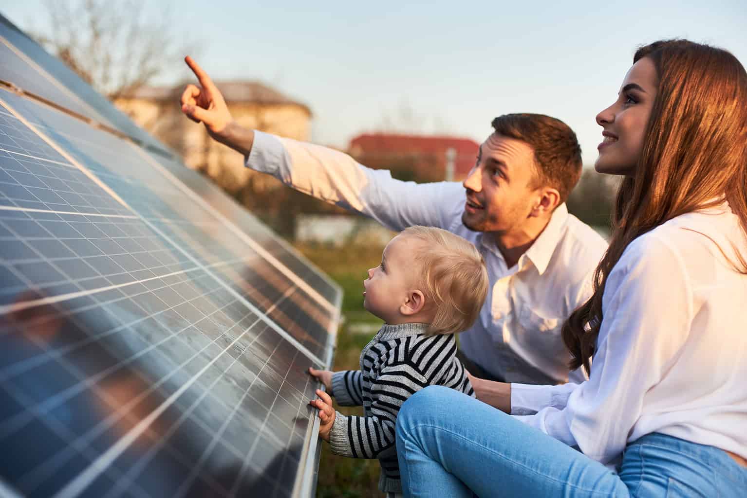 Man Shows His Family The Solar Panels On The Plot Near The House