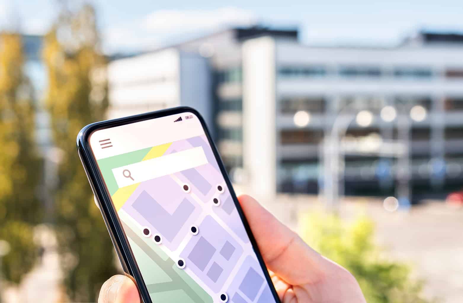 Map In Phone With City Street Network And Place Pointers. Locati