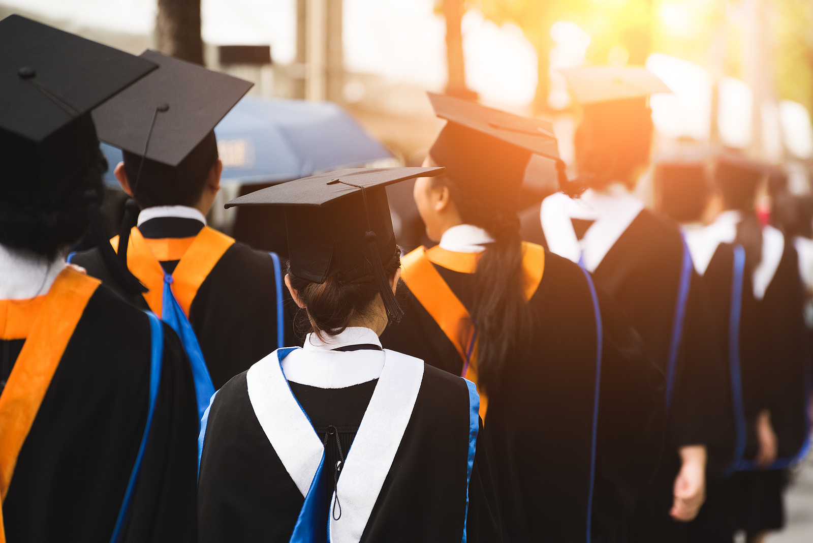 Rear View Of Graduates Join The Graduation Ceremony At The Unive